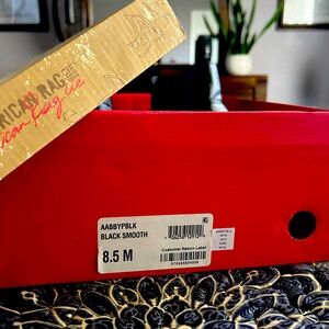 So cute!!!! Black booties. Clean home. Very hard to let go.